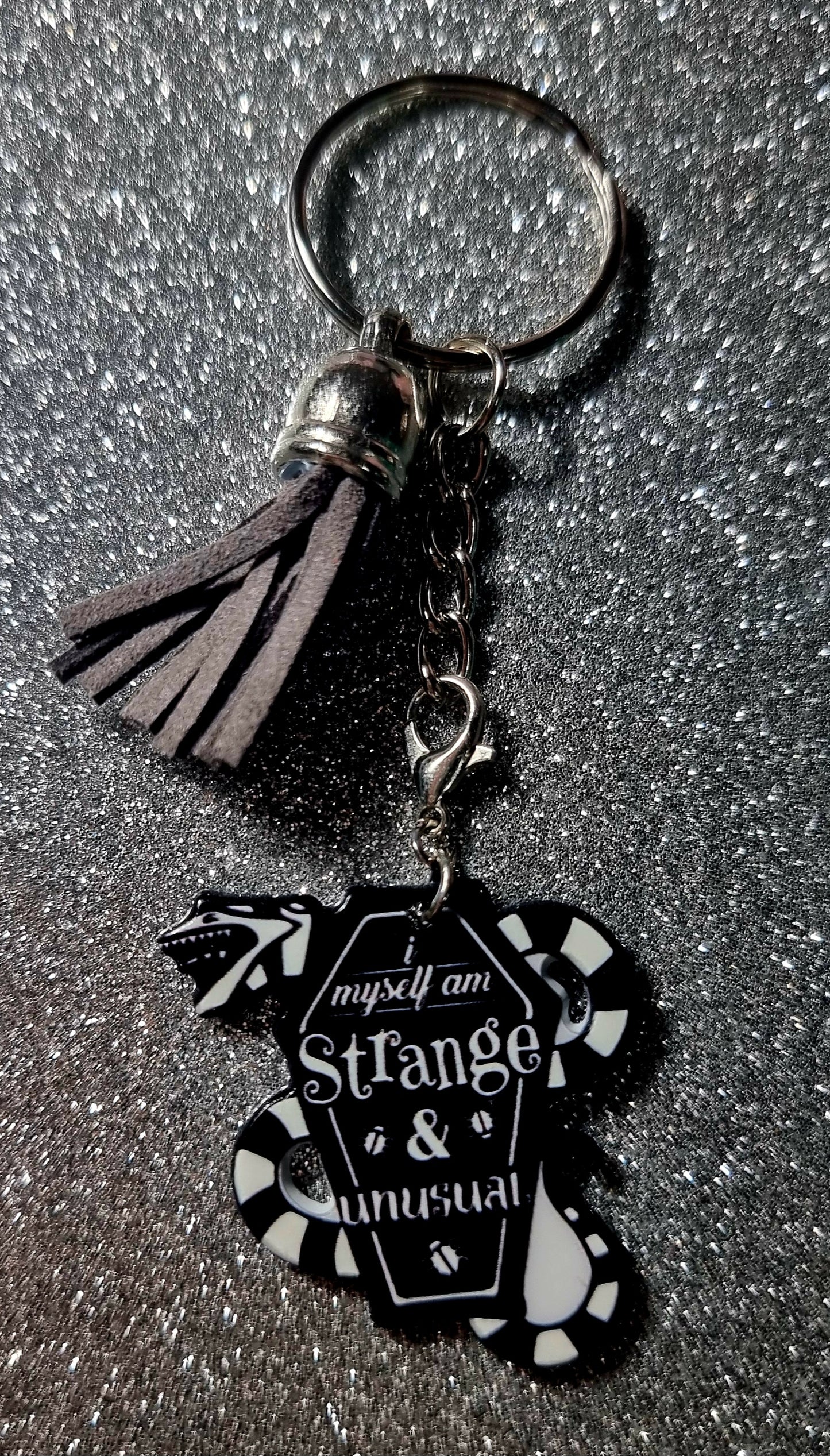 Strange and Unusual Keychain